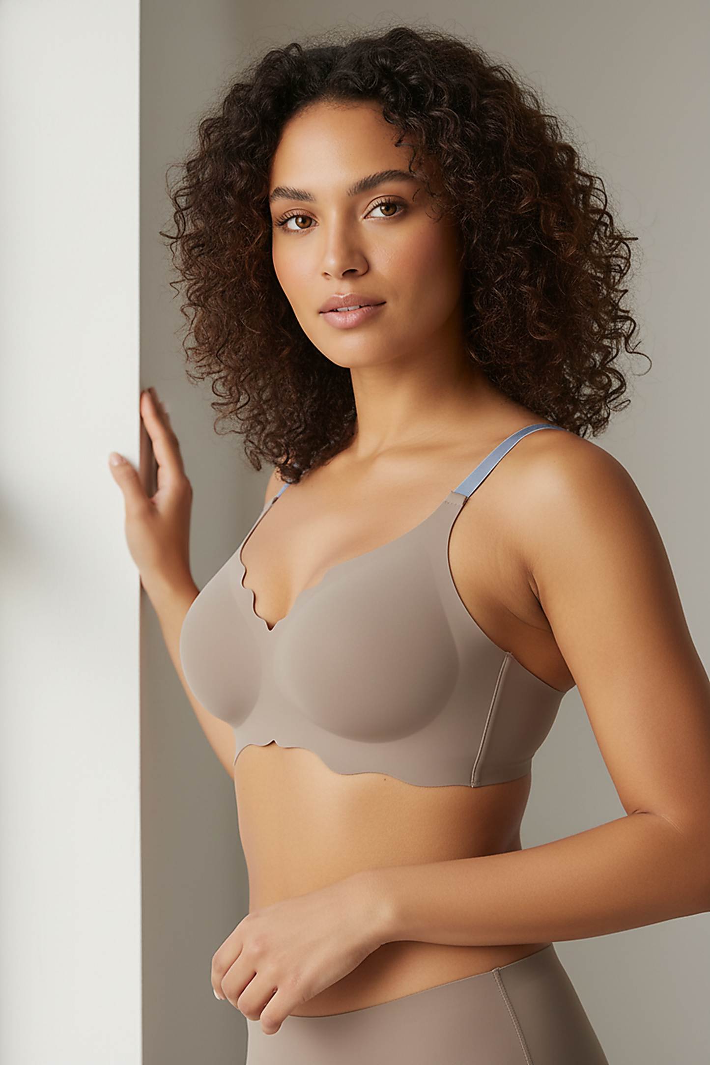 Neutral bralette, indoor lifestyle shot on model.