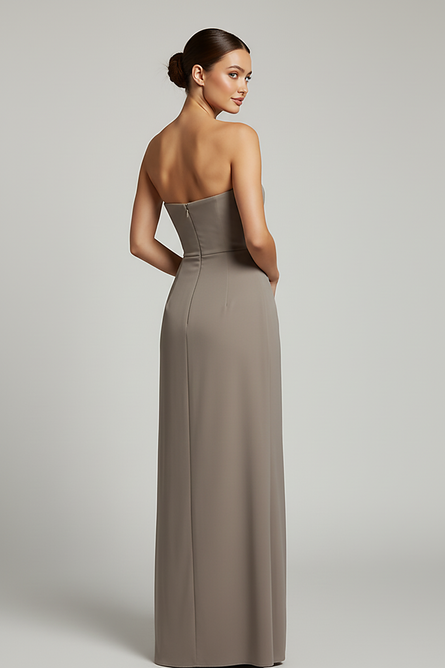 Black backless bodycon maxi dress with high split, back view on model.