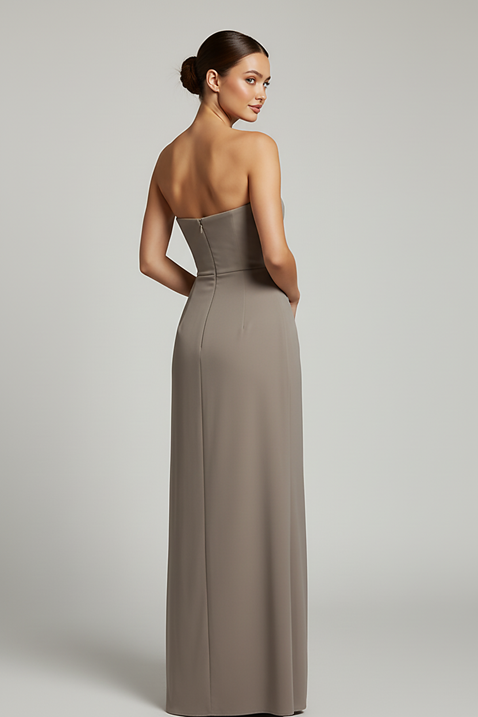 Black backless bodycon maxi dress with high split, back view on model.