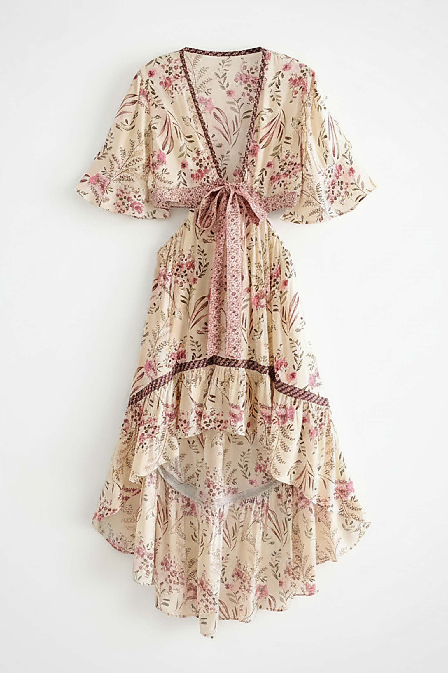 Patterned bohemian short sleeve dress, side view on model.