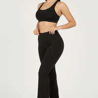 Black bootcut yoga pants, alternate angle view on model.