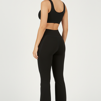 Black bootcut yoga pants, back view on model.