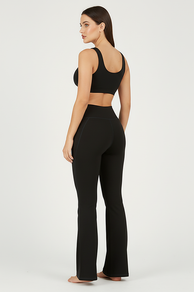 Black bootcut yoga pants, back view on model.