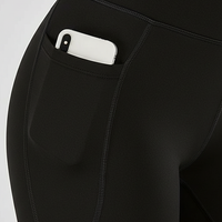 Black bootcut yoga pants, close-up fabric detail.