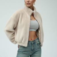 Black faux fur jacket, back view on model.