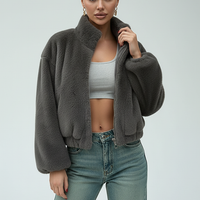 Blue faux fur jacket, front view on model.