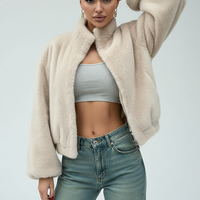 Cream faux fur jacket, front view on model.