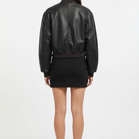Distressed faux leather bomber jacket, model in dynamic pose.