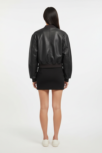 Distressed faux leather bomber jacket, model in dynamic pose.