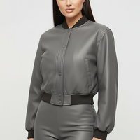 Distressed faux leather bomber jacket, interior lining detail.