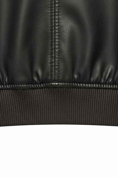 Distressed faux leather jacket, close-up of distressed texture.
