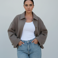 Women's solid wool jacket, back view on model.