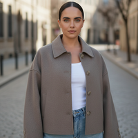 Solid wool jacket, detail of single-breasted closure.