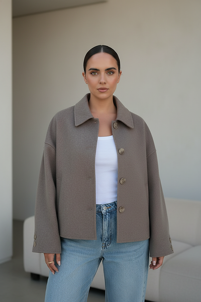 Solid wool jacket, close-up of sleeve and cuff.