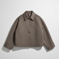 Solid wool jacket, fabric texture detail.