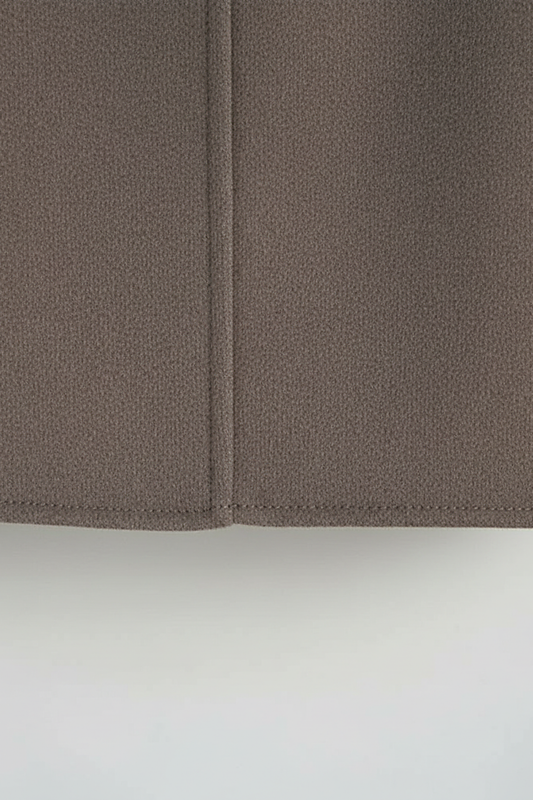 Women's solid wool jacket, styled with accessories.