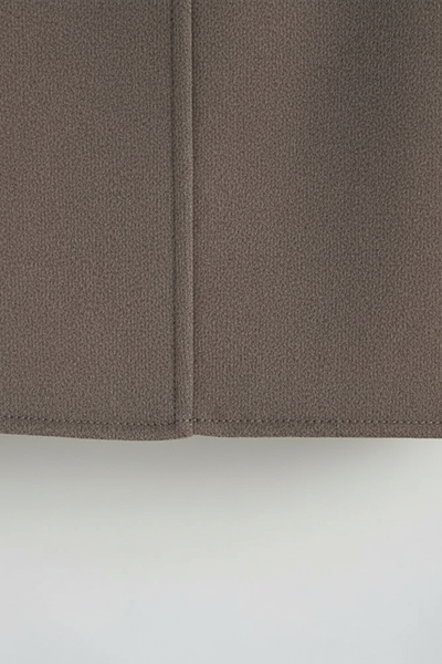 Women's solid wool jacket, styled with accessories.