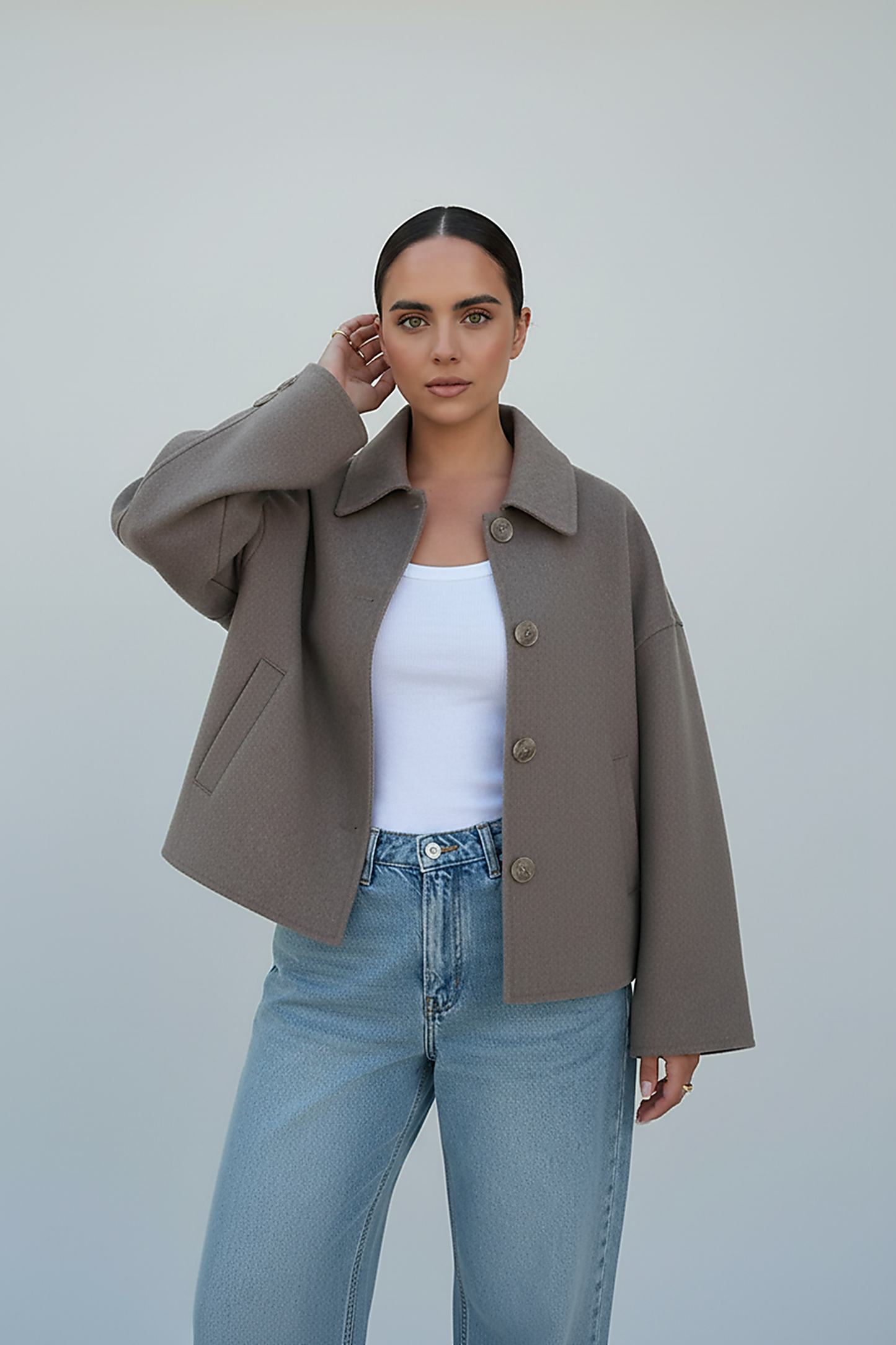 Women's solid wool jacket, front view, unbuttoned.