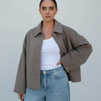 Women's solid wool jacket, front view on model.