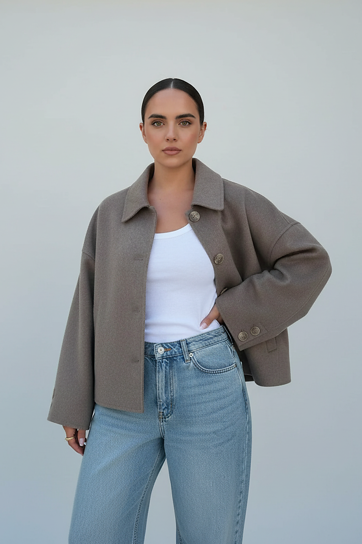 Women's solid wool jacket, front view on model.