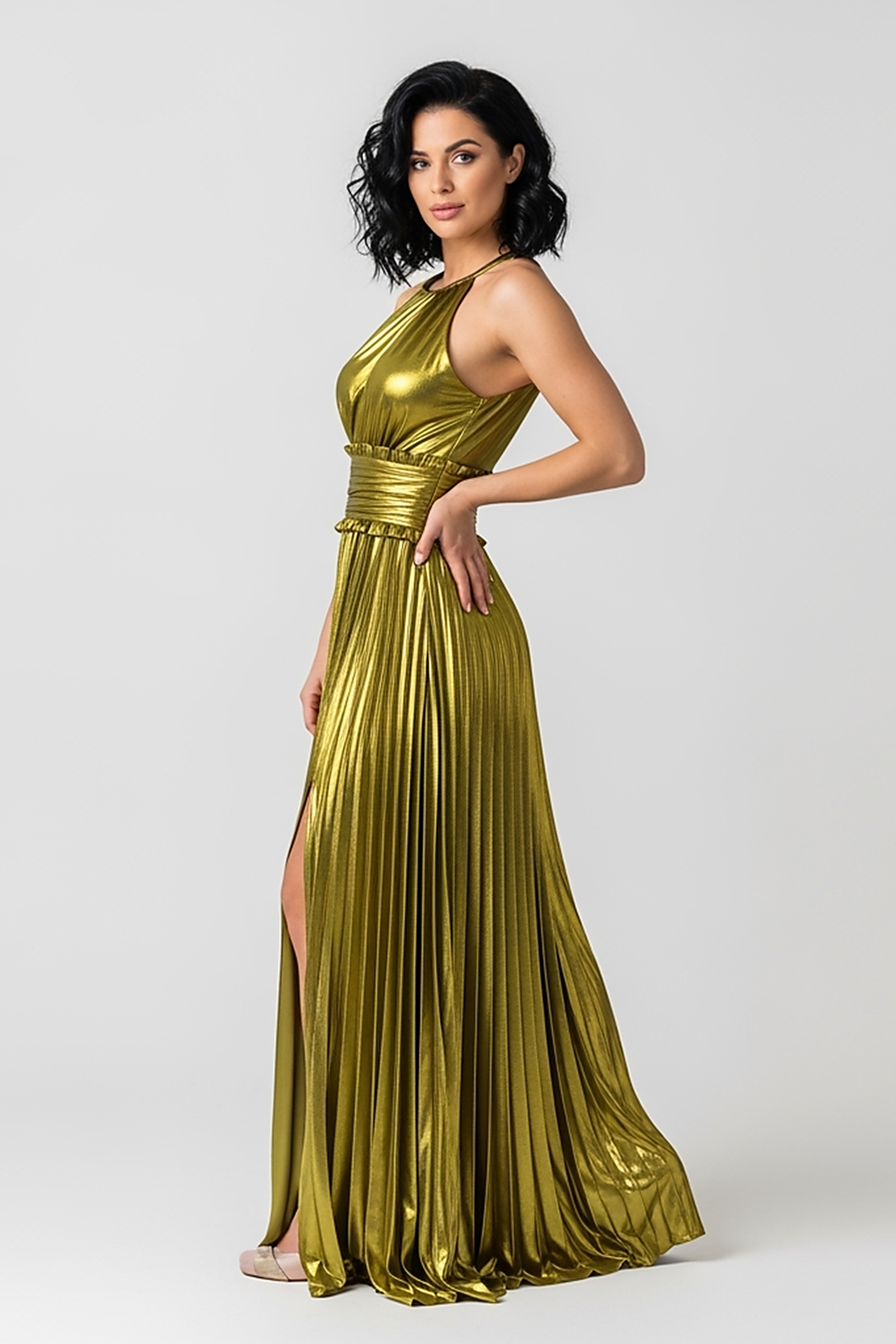 woman wearing black ribbed knit mini dress, front view, standing, hands relaxed