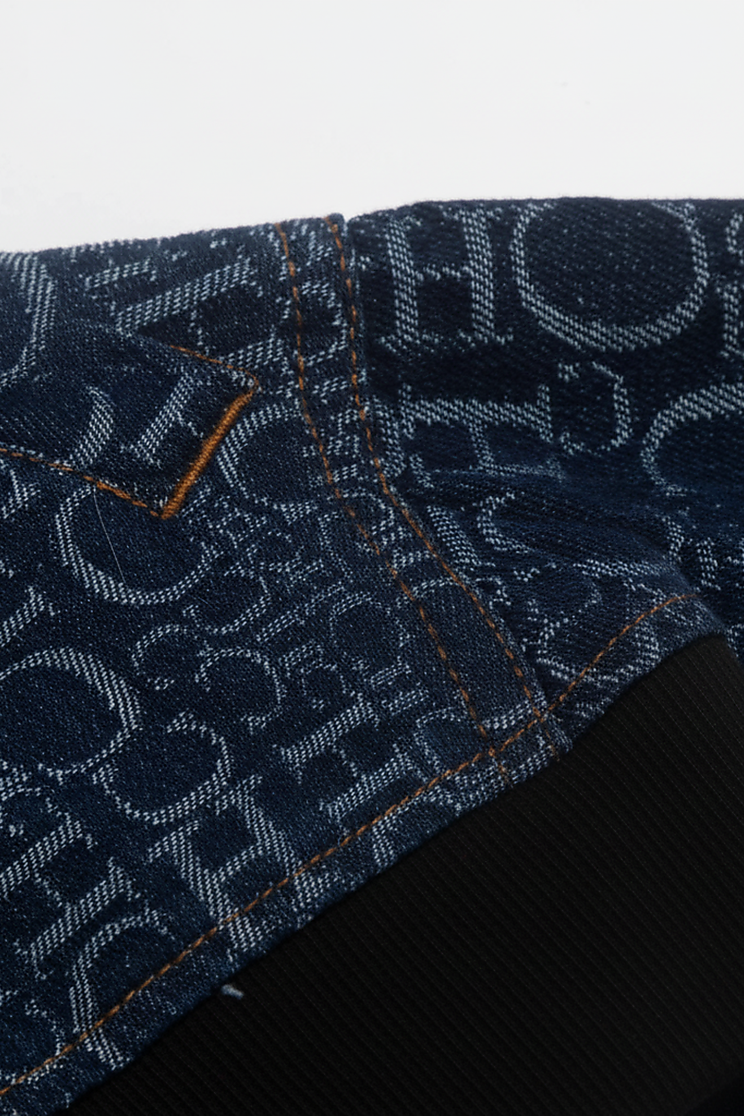 Women's blue denim jacket, side view on model.