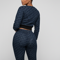 Women's blue denim jacket, front view on model.