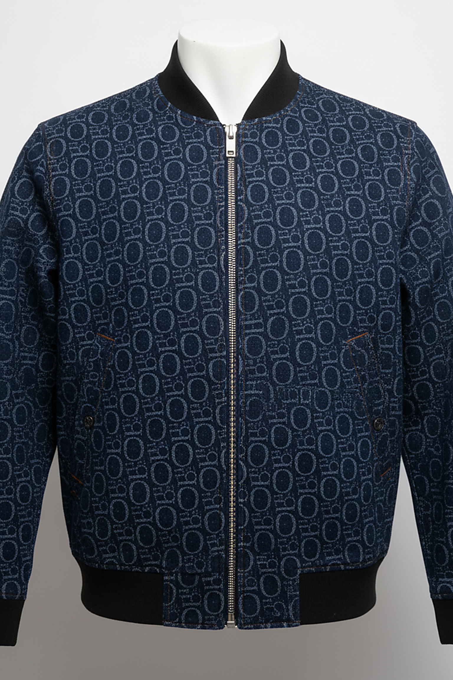 Women's blue denim jacket, fabric detail.