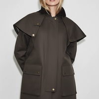 Removable hooded coat, side view on model.