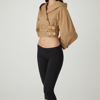 Black hooded crop trench coat, back view on model.