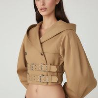 Black hooded crop trench coat, close-up of pocket.