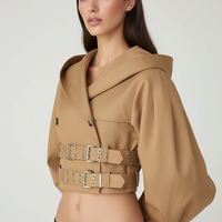 Black hooded crop trench coat, front view on model.