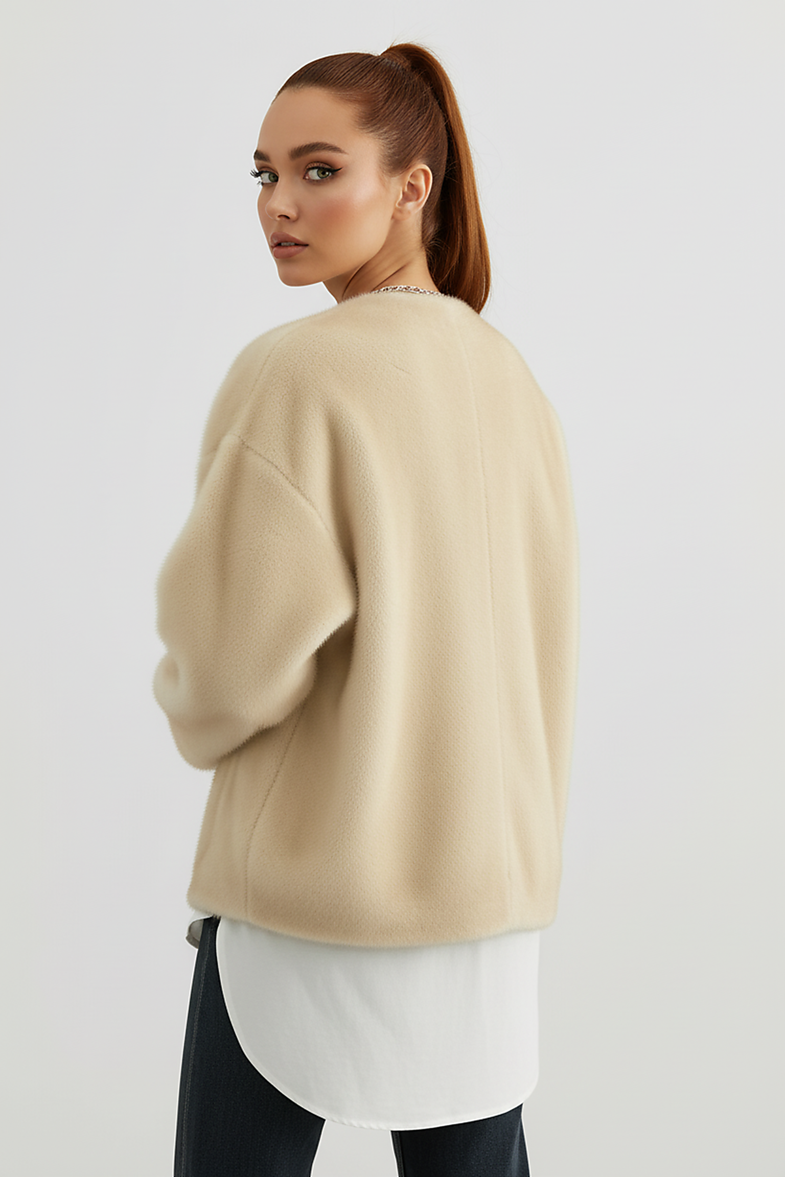 Solid plush coat, side view on model.