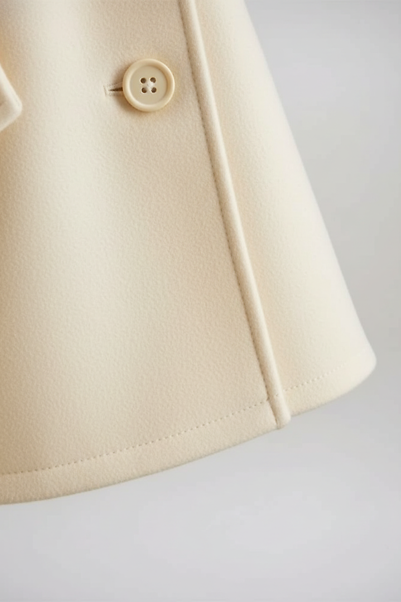 Vintage cape jacket hem detail.