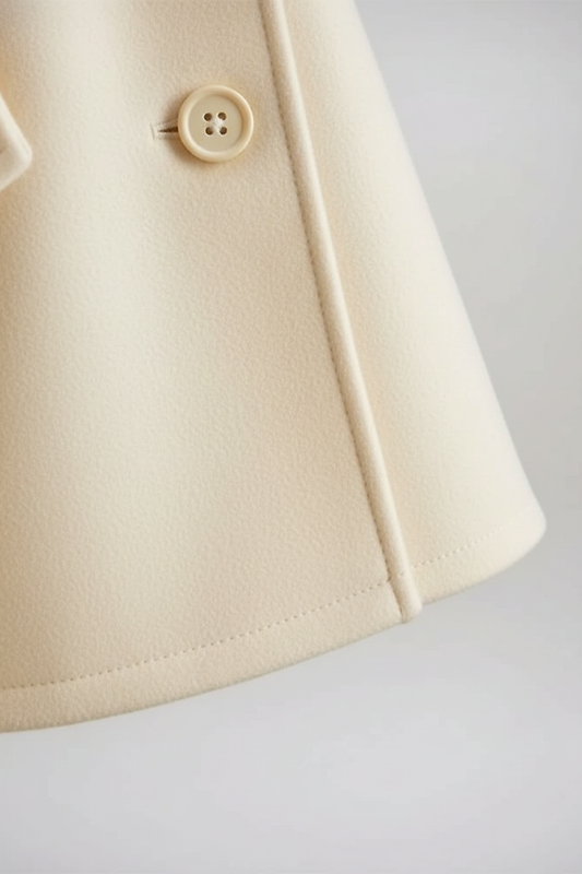 Vintage cape jacket hem detail.