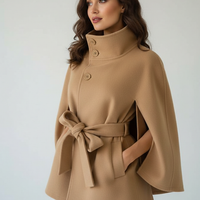 Vintage cape jacket with belt, front view on model.