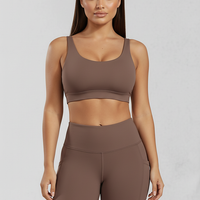 Solid yoga shorts with pockets, alternate angle view on model.