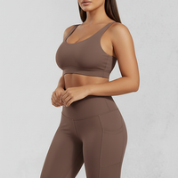 Solid yoga shorts with pockets, alternate angle view on model.