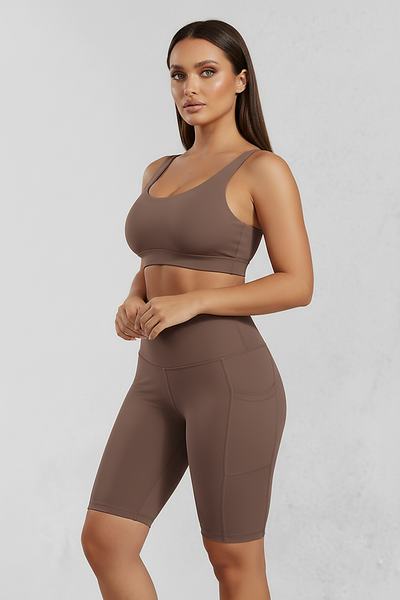 Solid yoga shorts with pockets, alternate angle view on model.