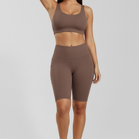 Solid yoga shorts with pockets, alternate angle view on model.