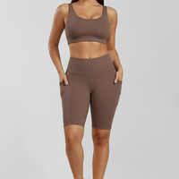 Solid yoga shorts with pockets, alternate angle view on model.