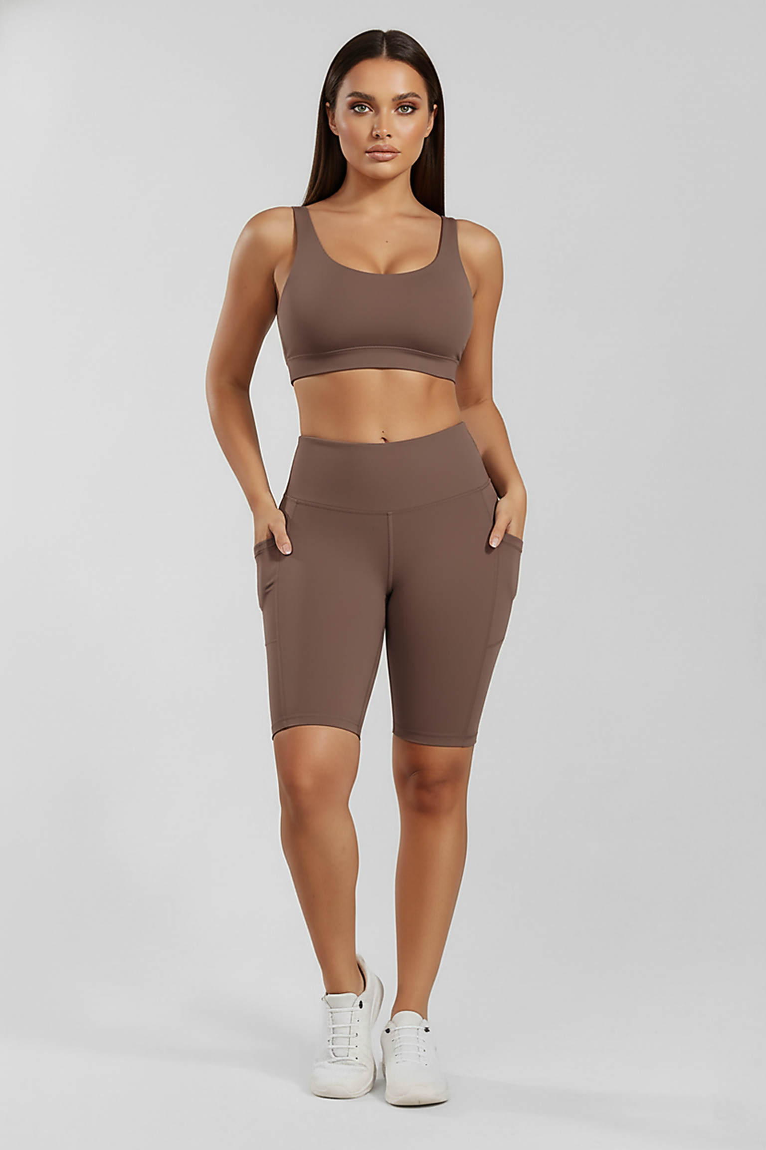 Solid yoga shorts with pockets, alternate angle view on model.