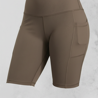 Solid yoga shorts, close-up fabric and pocket detail.
