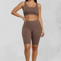 Solid yoga shorts with pockets, front view on model.