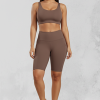 Solid yoga shorts with pockets, front view on model.