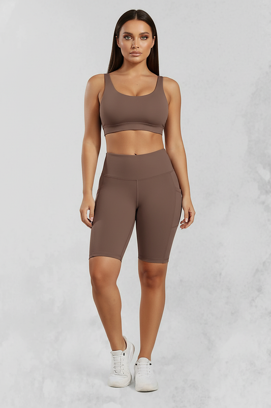 Solid yoga shorts with pockets, front view on model.