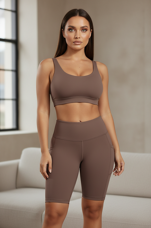 Solid yoga shorts with pockets, indoor lifestyle view on model.