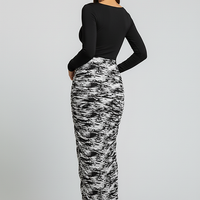 Stacked ruched long-sleeve patchwork print bodycon midi maxi dress, front view.