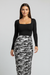 Stacked ruched long-sleeve patchwork print bodycon midi dress, front view on model.