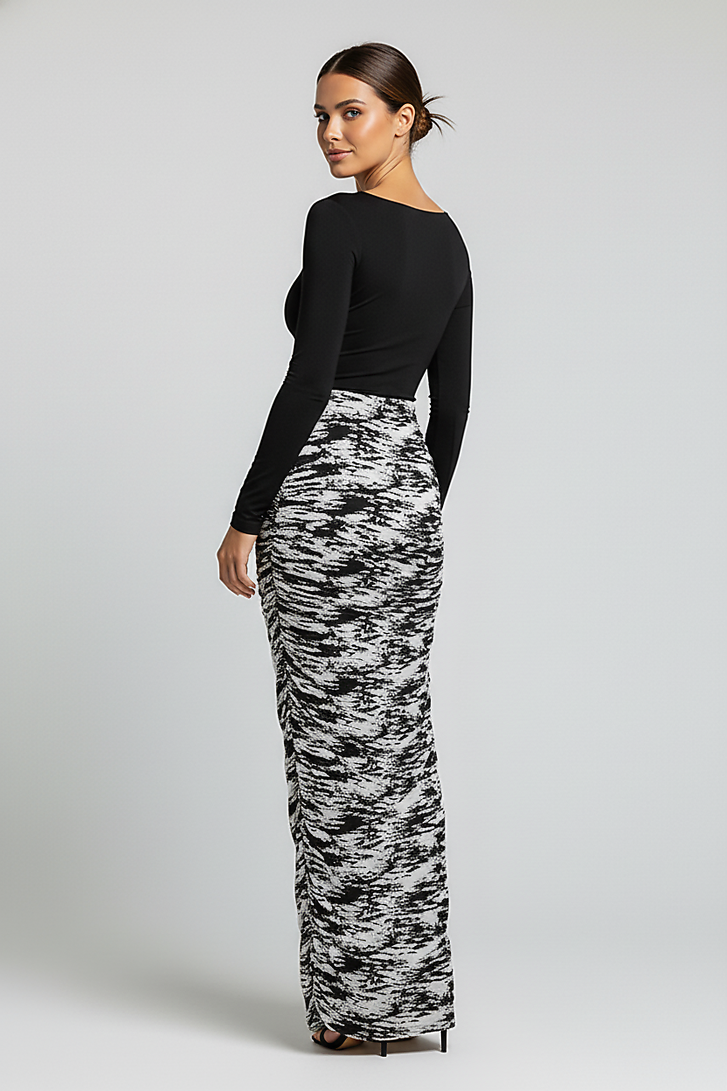 Stacked ruched patchwork print bodycon midi dress, front view on model.